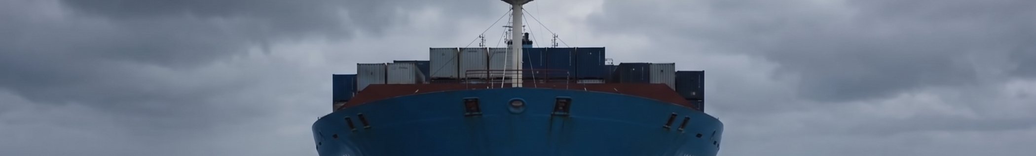 Loaded container vessel making way through an Atlantic swell